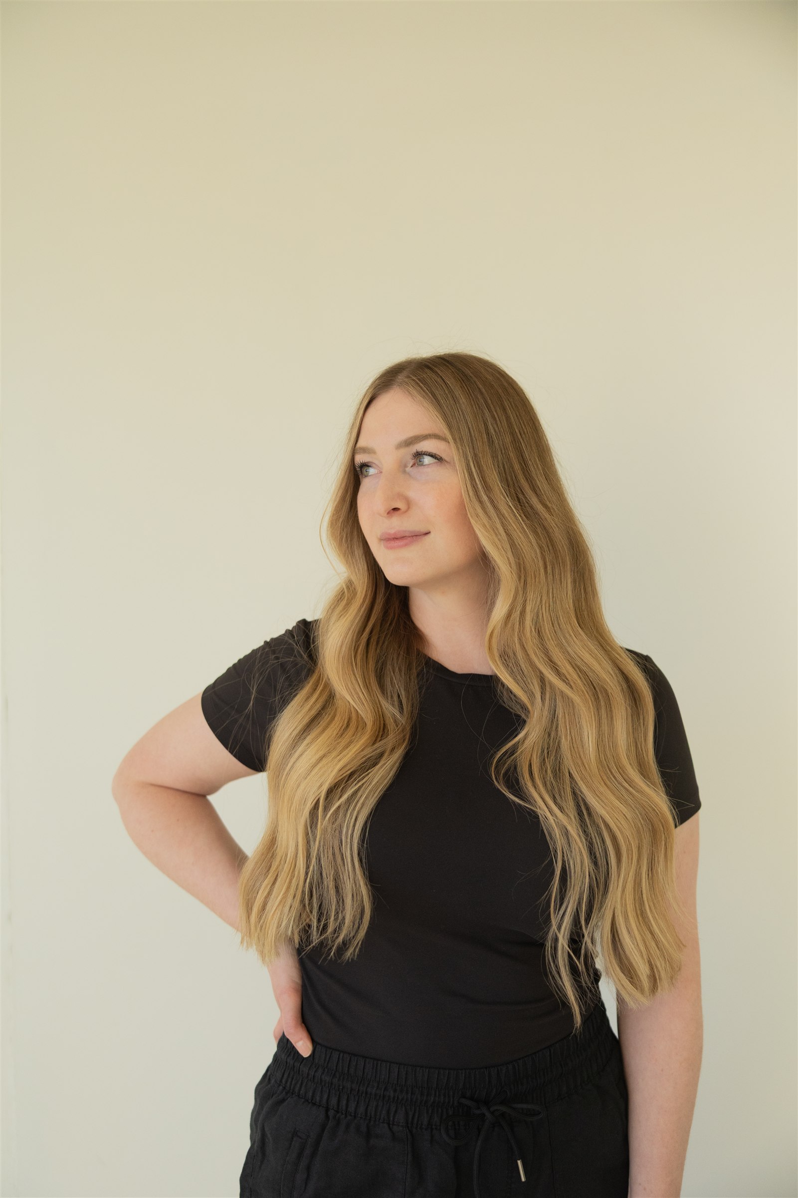 Madison Prim in black attire against a softly lit neutral background